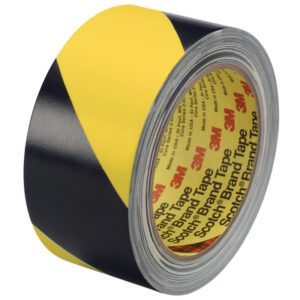 The 2 x 36 yds. (2 Pack) Black/Yellow 3M Safety Stripe Vinyl Tape 5702, tightly wound and featuring the familiar caution pattern, is ideal for hazard marking and marked with Scotch Brand Tape on the inner ring.