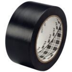A six-pack of 3M General Purpose Vinyl Tape 764 in black features a glossy finish and measures 2 x 36 yds., with a white inner core that shows its plaid design as you unwind the tape.
