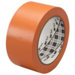 Introducing the 2 x 36 yds. Orange 3M General Purpose Vinyl Tape 764, with a plaid-patterned core. Ideal for various adhesive tasks, it comes in a case of 24 rolls, ensuring you always have enough for any project.