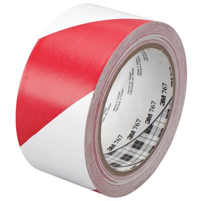 T967767.jpg A roll of 2 x 36 yds. Red/White 3M Safety Stripe Vinyl Tape 767, featuring diagonal stripes and visible branding on the inner core, is partially unrolled to display its pattern, ensuring optimal visibility for safety uses.