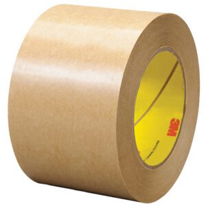 A roll of 3 x 60 yds. 3M™ 465 Adhesive Transfer Tape Hand Rolls (12 Rolls/Case) stands upright against a white background, featuring a yellow core with a red 3M logo and a shiny surface that highlights its adhesive quality.