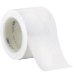 A roll of 3 x 36 yds. White 3M Vinyl Tape 471 (12/Case) lies at an angle, showing its semi-transparent glossy finish and visible printed inner core, suggesting durability for versatile uses.