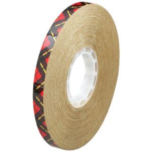 The 1/2 x 60 yds. 3M™ 924 Adhesive Transfer Tape, with a clear core and tan color enhanced by a black and red plaid edge, combines function with style.