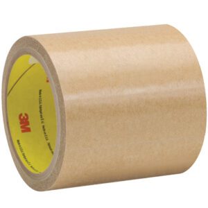 A roll of 3M™ 9458 Adhesive Transfer Tape with a yellow core and red 3M logo rests against a white background. Measuring 4 1/4 x 60 yds., it highlights its wide width and glossy finish, representing durability with two additional rolls in the set.