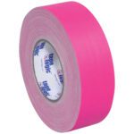 A 2 x 50 yds. roll of fluorescent pink Tape Logic® 11 Mil Gaffers Tape, featuring a textured surface, is part of a convenient 24 roll/case set.