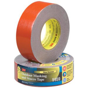 Two rolls of 3M Outdoor Masking and Stucco Tape are shown, one upright displaying its red adhesive surface akin to the durable 2 x 45 yds. Red 3M™ 5959 Duct Tape; the other lies flat with its label visible, highlighting clean removal and substantial 90-day UV resistance.