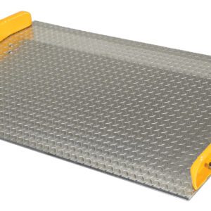 The ramp, with bright yellow side guards and a metal diamond plate surface, resembles the Vestil Aluminum Dock Board Steel Curb 10K 60X36, featuring angled access for vehicles or equipment like models with steel curbs supporting up to 10K.