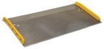 The Vestil Aluminum Dock Board Steel Curb 10K 72X36 features a diamond plate surface, yellow raised edges, and a steel curb for added durability, ensuring stability and traction. Its slightly upward angle makes it ideal for handling loads up to 10K effortlessly.