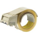 The beige 3M™ H122 - 2 Hand Held Carton Sealing Tape Dispenser includes a cutting blade and comfortable handle for easy use, with a partially unwound roll of transparent tape on a light surface, ready to efficiently seal your packages.