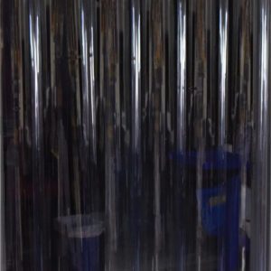 A Vestil Vinyl Strip Door 0.06 In Full Wall 96 X 96 hangs in a doorway, providing transparency and flexibility while slightly overlapping strips separate two areas, allowing visibility of indistinct objects in the dim light behind it.