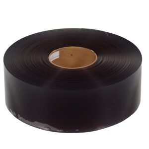 A large roll of black plastic film, similar to the Vestil Roll for Vinyl Strip Door 0.06 Thickness, has a sturdy brown cardboard core, is coiled neatly, and viewed from a slight angle.