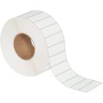 A roll of MH-USA 3 x 1 White Thermal Transfer Labels (5000/Roll) with a brown cardboard core shows several evenly spaced labels unraveling along its length.