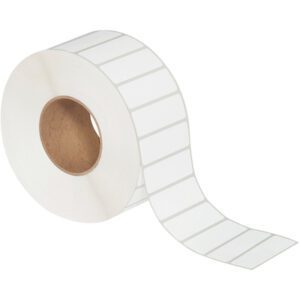 A roll of MH-USA 3 x 1 White Thermal Transfer Labels (5000/Roll) with a brown cardboard core shows several evenly spaced labels unraveling along its length.