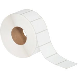 The MH-USA 3 x 2 White Thermal Transfer Labels (3000/Roll) unwind from a sturdy brown core, with each label aligned in a single column and perforated for easy separation. A few labels are already extended, ready for use.