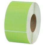 A roll of MH-USA 4 x 6 Green Thermal Transfer Labels (1000/Roll) with a white backing is displayed on its side, showcasing the core center and outer label surface in vivid detail.