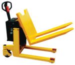 The bright yellow Vestil Tilt Master DC Powered tilt truck, featuring a sturdy handle and two wheels, efficiently handles materials with its 2200 lb capacity and long forks for lifting and tilting pallets in warehouses or storage facilities.