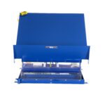 The industrial waste compactor, echoing the hue of a Vestil Lift Table 6K 48X48 Blue, features a large open lid revealing intricate machinery. It rests on a flat base with a yellow emergency stop button attached by a cord, emphasized against its plain white backdrop.