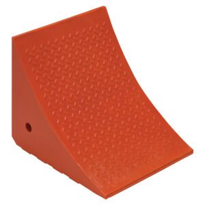 The Vestil Jumbo Urethane Wheel Chock 14.8X17.5X15 is orange, triangular, textured, and features a sloped front for wheel security plus a small side hole for easy handling.