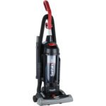 The Sanitaire® FORCE™ QuietClean® Bagless HEPA Vacuum showcases a red handle and black body, with its brand name on the dust container. It is designed for easy use, featuring wheels for mobility and a side hose attachment for versatile cleaning.