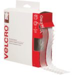 The 3/4 x 15 Clear VELCRO® Brand Tape Combo Pack features a clear strip, partially extended, with packaging in white and red for easy dispensing.