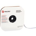 A square Velcro-branded dispenser with a black circular opening dispenses 1/2 x 75 White VELCRO® Brand Tape individual strips. The box includes black text with contact information and warnings for efficient use.