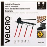 The Industrial Strength Velcro packaging is multilingual and features a 1 x 50 Black VELCRO Brand Tape. It secures five tools, such as a shovel and rake, to a wall. Sold as Industrial Strength Combo Packs, one per case, specifications are detailed on the packaging.
