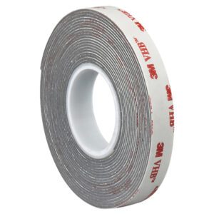A 1 x 5 yds. Gray 3M™ 4941 VHB™ Tape roll with white backing and red text is coiled around a white plastic core.