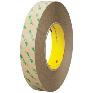 A 3/4 x 5 yds. roll of clear 3M™ F9469PC VHB™ Tape showing a brown backing with green logos and a yellow inner core.