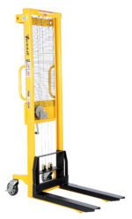The yellow Vestil Manual Hand Winch Fix Stacker boasts a 770-pound capacity, two black forks, a mesh safety screen, an operational handle, and wheels for easy mobility. Its lifting mechanism is visible and safety labels are displayed on the side.