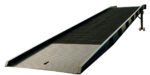 The Vestil Steel Yard Ramp Overlap Style 25K 85X36 has a grated metal surface, raised edges, and adjustable legs with wheels. Its slightly inclined, with a forklift access slot at the base for easy portability.