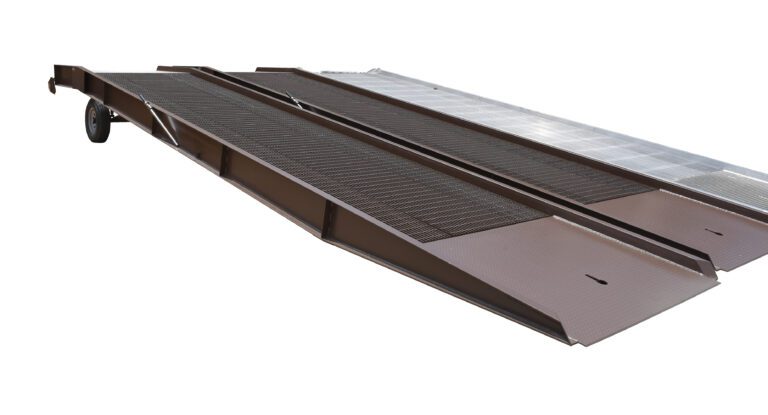 The Vestil Steel Yard Ramp Overlap Style 30K 85X36 features a grated metallic surface, a wheel on one end, and is angled downward for easy vehicle loading onto trailers.