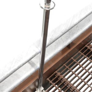 The Vestil Yard Ramp Option Pnu Tire & Manual Lift includes a vertical retractable stanchion with a black handle on a grated metal edge, enhancing crowd control or safety barriers, strategically placed at the platforms corner.