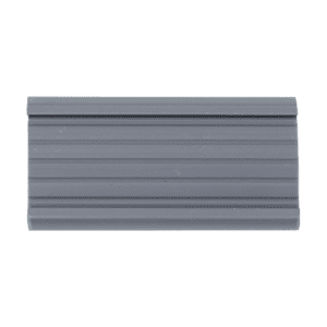 A gray, rectangular Metro 9990P Super Erecta Label Holder, measuring 3 x 1.25 with horizontal ridges and a slight curve on one side, is set against a black background.