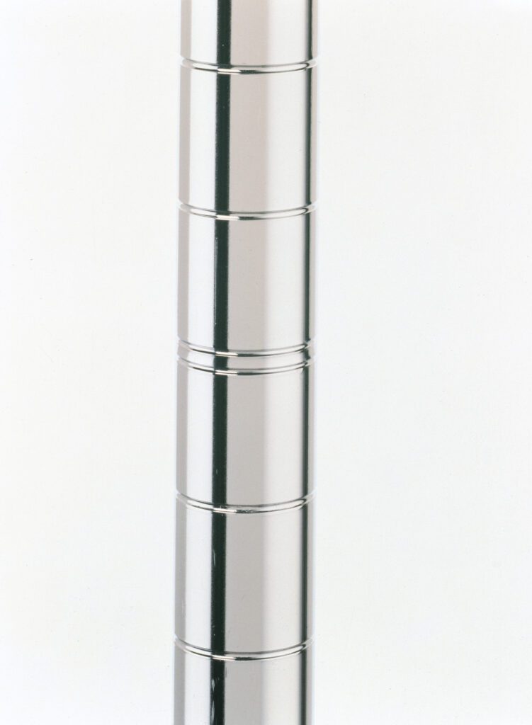 A vertical stack of shiny, metallic discs aligned against a plain background. The discs are uniformly spaced, reflecting light, and creating a sleek, modern appearance.