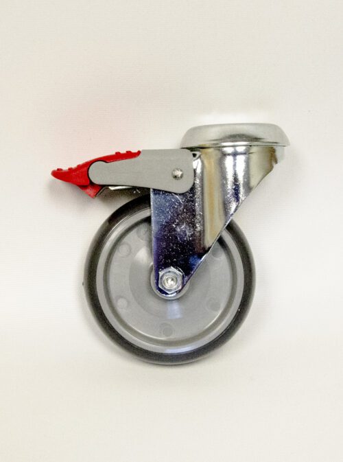 A single swiveling caster wheel with a metal frame and a red brake lever is displayed against a plain white background. Perfect for high-quality laboratory furniture, the wheel is made of gray rubber with a metallic mount and black edges.