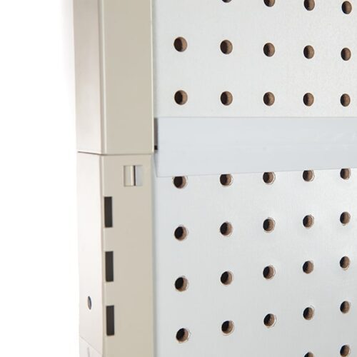 Close-up of a light gray perforated metal panel with evenly spaced round holes, similar to the Vulcan SP EXTENDER 18 X 24 BLACK. The panel on the left vertical structure has rectangular edge cutouts, contrasting its sleek surface.