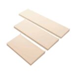 The Vulcan SP SHELF 24 X 12 ALMOND features three diagonally arranged cream-colored foam boards on a white backdrop, each with a smooth surface and slightly rounded edges, up to 24 x 12 inches.