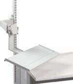 A light gray, adjustable book holder attached to a slotted metal arm on the side of a desk or shelf. The holder has angled, flat surfaces designed to support a book or document for easy reading.