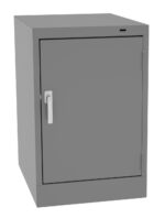 A gray metal cabinet with a single door and a handle on the left side. It is a rectangular, industrial-style storage unit with a smooth surface, positioned upright against a neutral background.