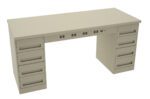 A beige metal desk with two sets of drawers on each side and a series of round holes across the front edge for cable management. The desk has a simple, industrial design with a flat top surface.