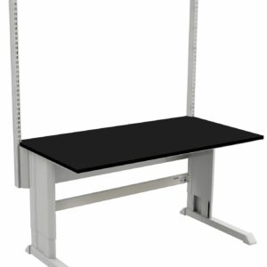 A black workbench with a sturdy metal frame is shown, ideal for laboratories. It features a height-adjustable tabletop and vertical back support with perforated slots for accessories or storage units, blending modern industrial design with functionality akin to stainless steel gowning benches.