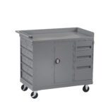 A gray metal rolling tool cart with multiple drawers and a central cabinet. It has swiveling wheels for mobility and a flat top surface. The cart features three small drawers on the left, two on the right, and a larger cabinet door in the middle.