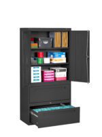 A black office storage cabinet with two upper doors open, revealing various supplies like folders, paper stacks, and boxes. Below, two drawers are partially opened, with the bottom drawer holding hanging file folders.