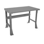 Gray metal workbench with a rectangular top and sturdy, angled legs. The bench features a supportive crossbar underneath the top, and its simple design suggests durability and functionality, ideal for industrial or workshop settings.