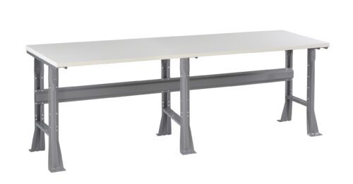 A long, rectangular workbench with a white tabletop and sturdy grey metal legs. The bench has a solid frame with horizontal support beams, suitable for industrial or workshop use. The design is minimalist and functional.