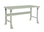 A light gray industrial workbench with a flat rectangular surface and sturdy legs. The bench has a support beam underneath for stability and appears to be made of metal. The design is simple and functional, suitable for various work environments.