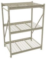 A metal storage rack with three wire mesh shelves. The frame is constructed from vertical and horizontal beams, designed for heavy-duty use. The shelves are evenly spaced, and the structure has a light gray finish.