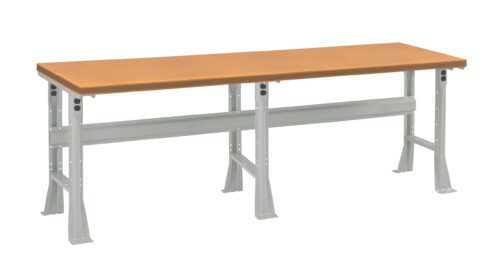 A long, rectangular workbench with a light brown wooden top and sturdy gray metal legs. The design includes a crossbar for added stability. The bench is suitable for various tasks and environments.