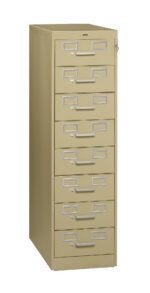 A beige vertical file cabinet with nine drawers, each featuring a silver handle and a label holder. The cabinet has a key lock near the top right.