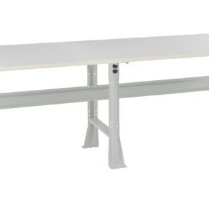 A long, rectangular, industrial-style workbench with a smooth, light gray tabletop and sturdy steel legs. The structure includes a horizontal support beam underneath. The design is simple and functional for workshops or labs.